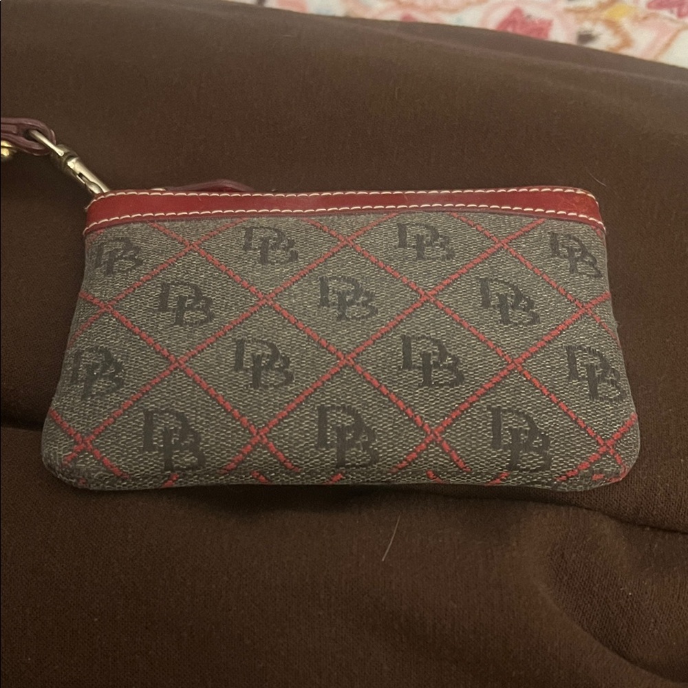 Dooney and Bourke wristlet Red Leather-Trim on gray fabric